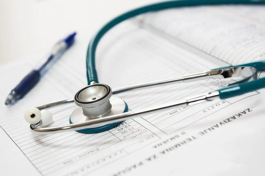 medical research documents with a stethoscope sitting on top