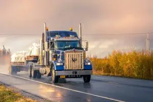 white and blue truck on road during daytime with a driver who needs CDL Physical